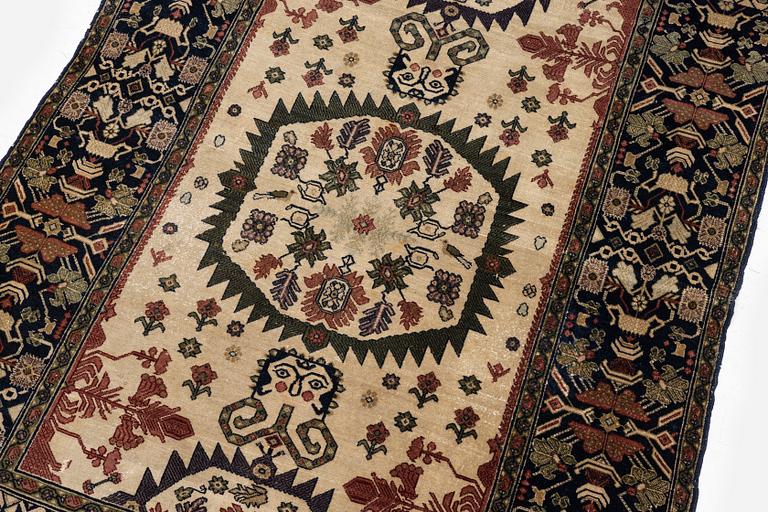 An antique Malajir rug, c. 179,5 x 124 cm (as well as one end with 2.5 cm flat weave).