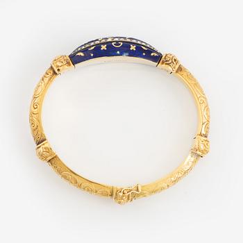 Armring, guld, blå emalj och rosenstenar.