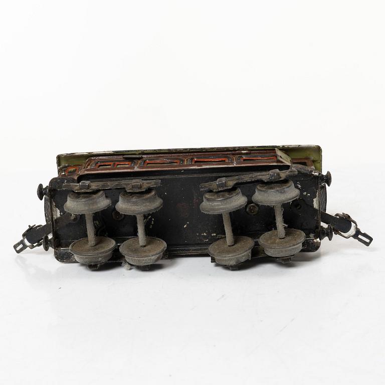 Model train with track and station building, 13 pieces, Germany, 1920s.