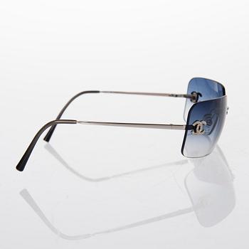 Prada and Chanel Sunglasses.