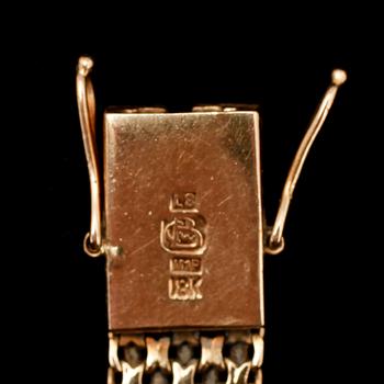 DAMARMBANDSUR, 18 k guld, Tissot. Tot vikt 17 g.