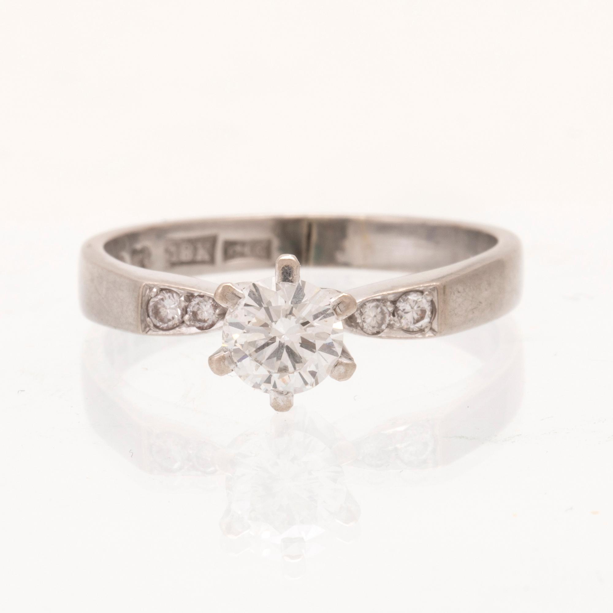 An 18K white gold ring set with round brilliant cut diamonds by Lundberg Guldatelje Amie Stockholm 1977.
