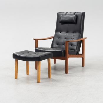 A 1970's teak and pvc coated fabric armchair and stool.