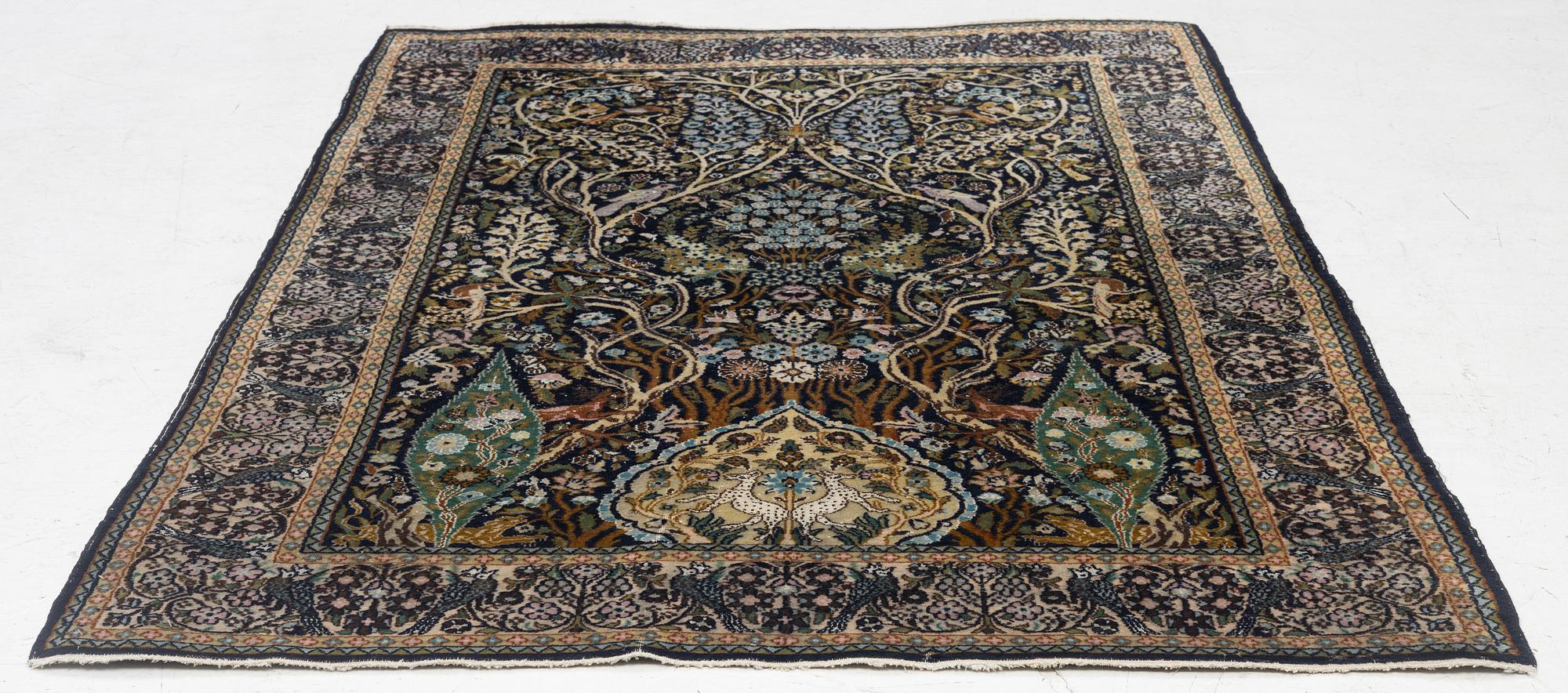 A figural Quum carpet, c. 179 x 125 cm.