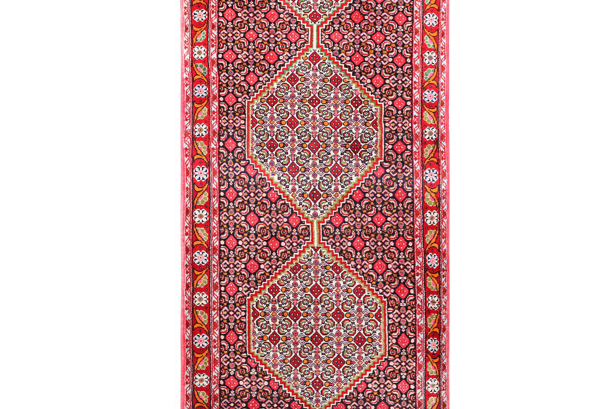 A Runner carpet, Senneh, c. 325 x 80 cm.
