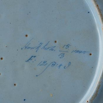 A Rörstrand faience dinner plate, dated Stockholm 15/3 1745.