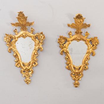 A pair of mid 20th century wood mirrors in Louis XV-style from Paoletti, Firenze Italy.