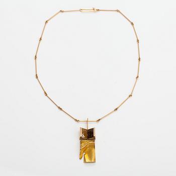 Björn Weckström, "Narcissos", a 14K gold pendant with a smoaky quartz and a rock crystal. Lapponia 1965.