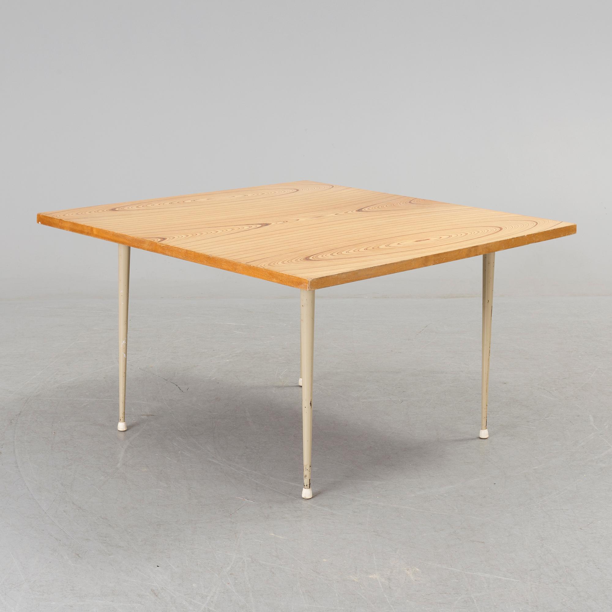 A coffee table marked Tapio Wirkkala, Asko, Made in Finland.