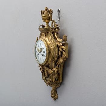 A brass wall clock marked A.W. Bruuns eftr, Lund from around year 1900.