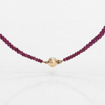 A necklace, set with rubies, clasp in 14K gold.
