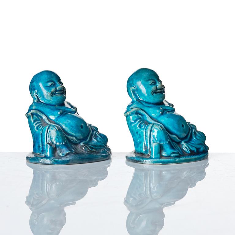 A pair of turquoise glazed joss stick holders in the shape of Buddai, Qing dynasty, 18th Century.