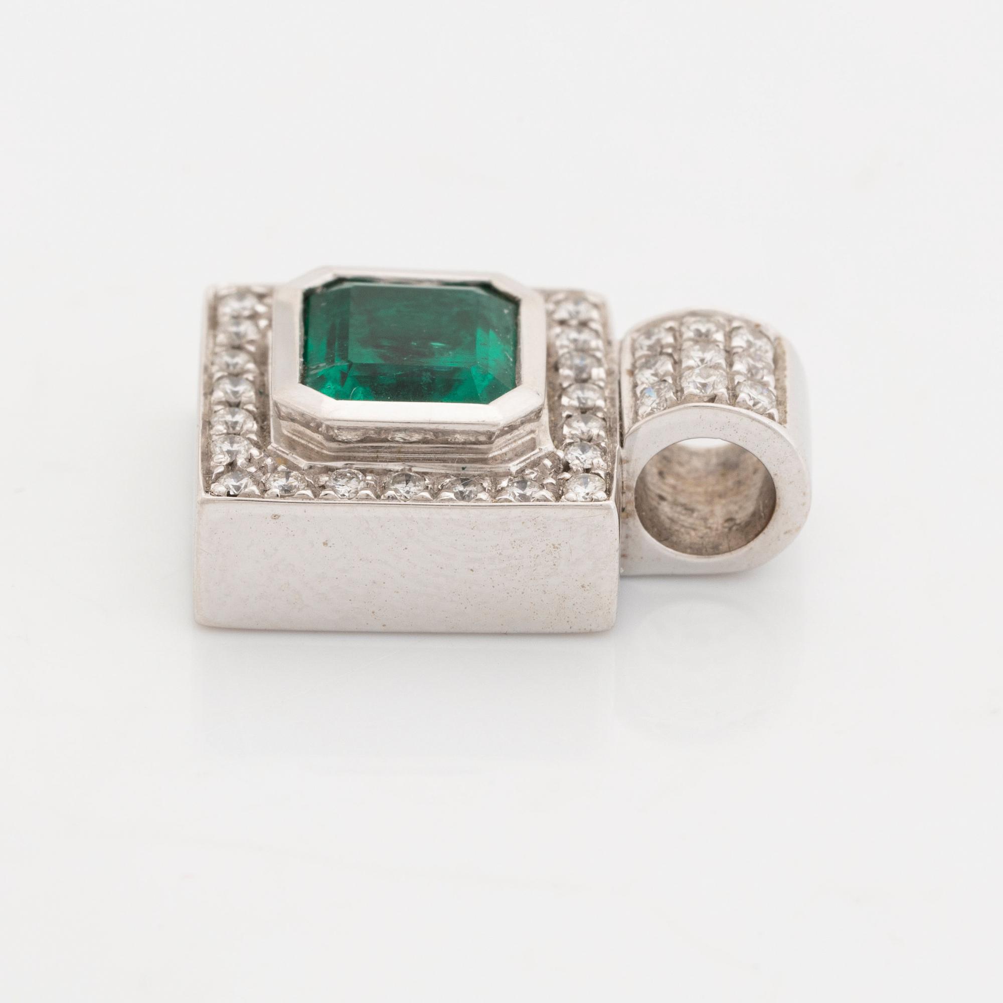 Emerald cut emerald and brilliant cut diamond pendant.