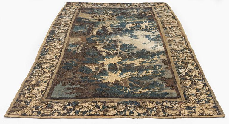 A 17th century Flemish 'verdur' entre-fenêtre tapestry, c. 268 x 130 cm.