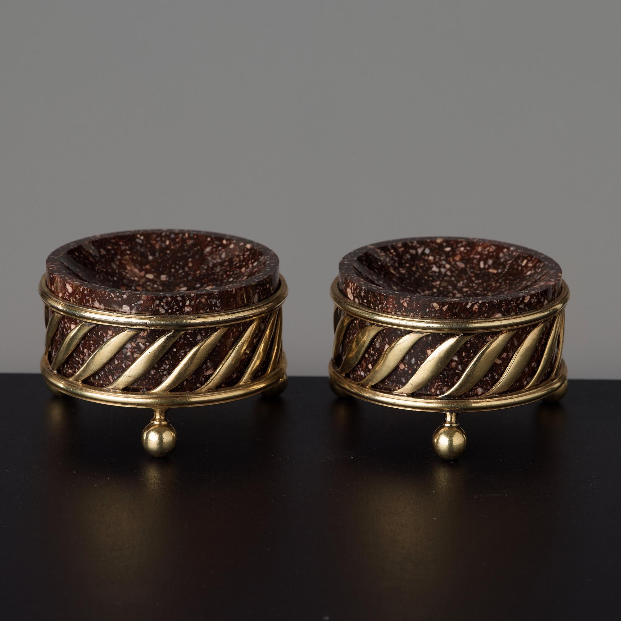 A pair of gilt silver and porphyry salts, by Gustaf Folcker, Stockholm 1827.