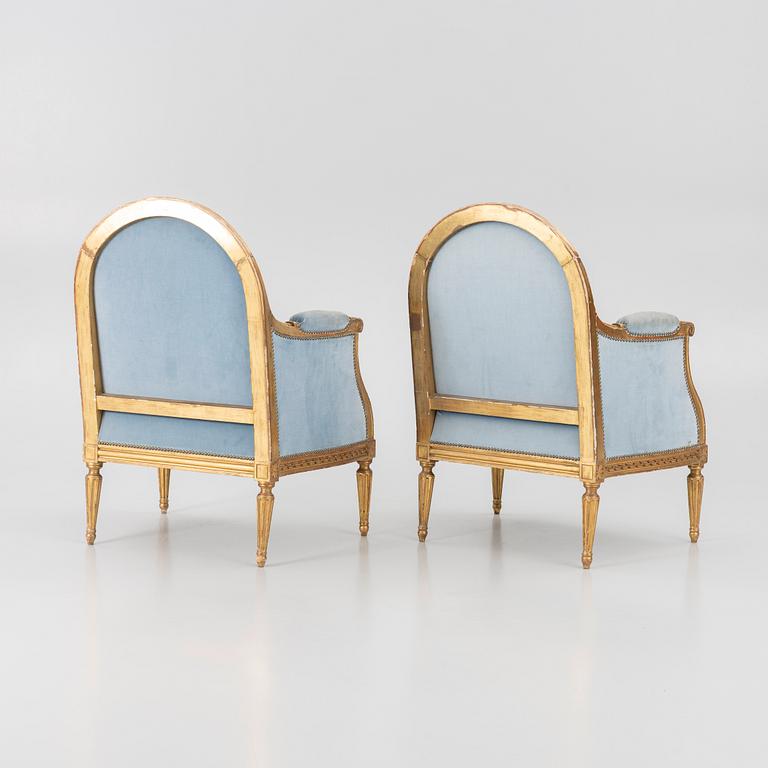 A pair of easy chairs, Louis XVI style, 20th century.
