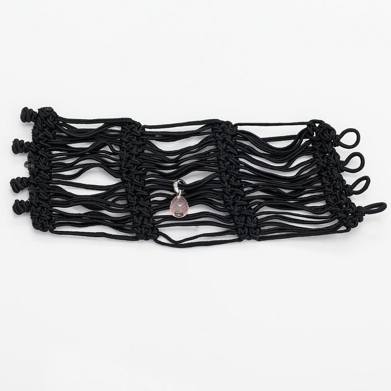 Ole Lynggaard, A satin like band bracelet with an 18K white gold and rose quartz "Sweet drops" pendant.