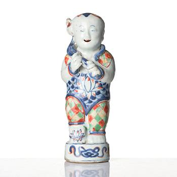 Three Chinese famille verte figures of laughing boys 'Hehe Erxian', 18th century.