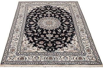 A carpet, Nain, part silk, ca 307 x 198 cm.
