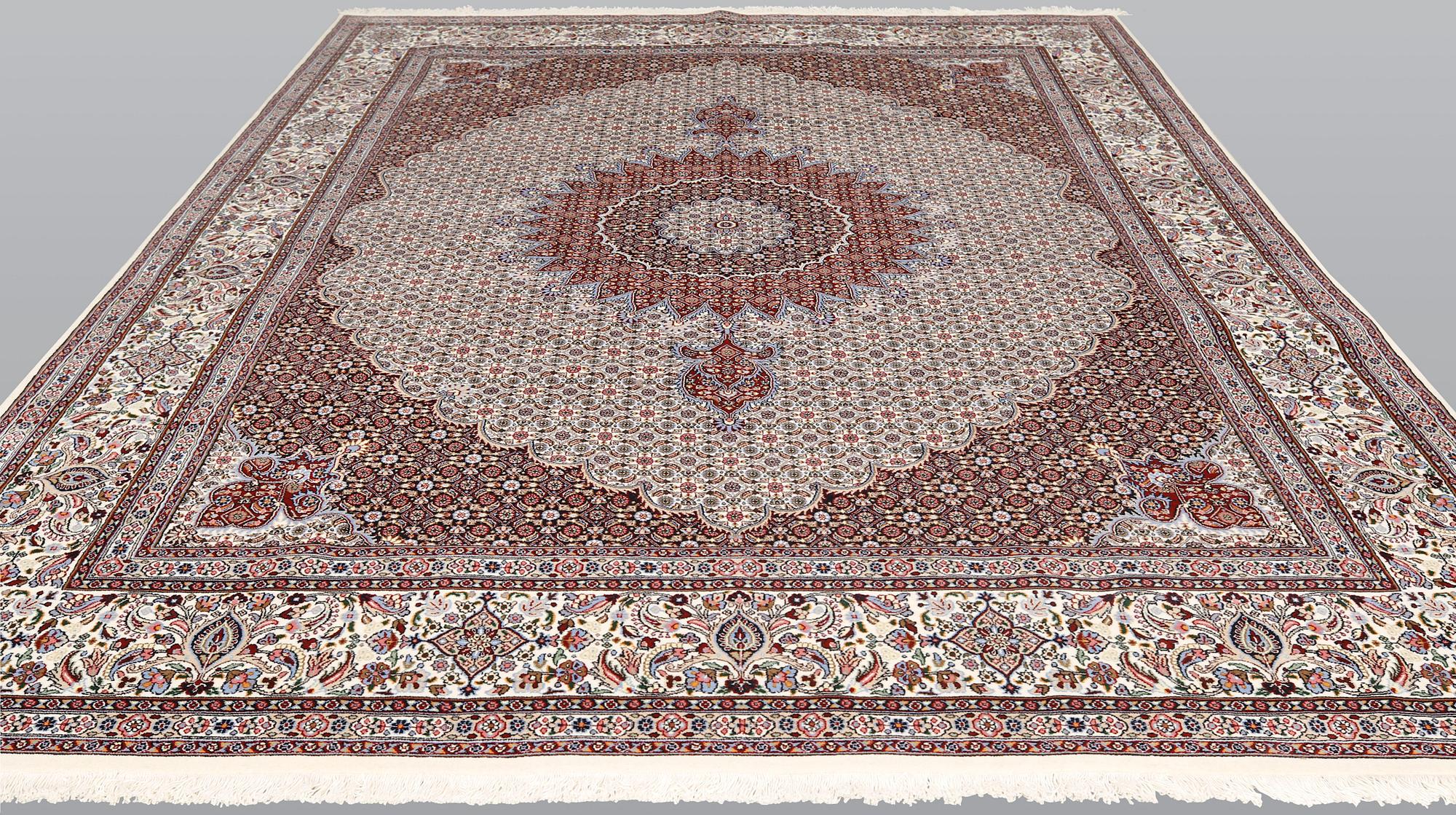 A part silk Moud carpet, approximately 350 x 252 cm.