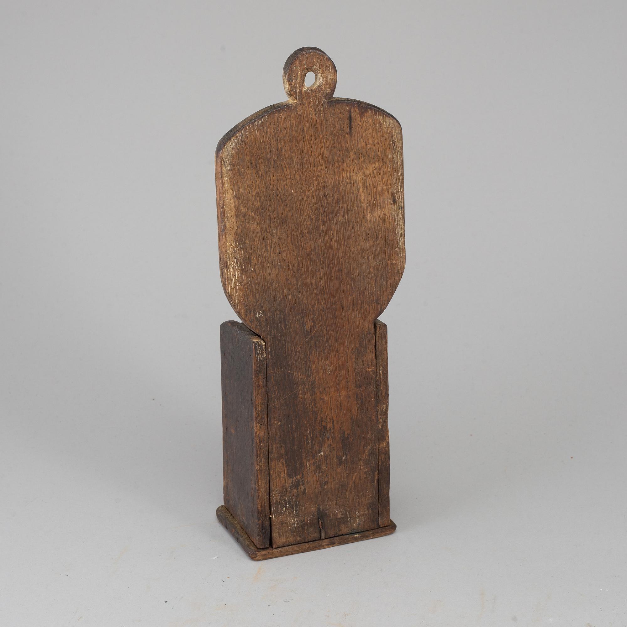 An 18th century brass and oak cutlery holder.