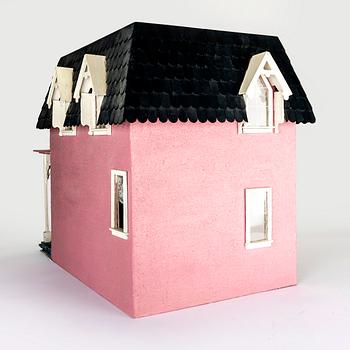 A handmade dolls house later part of the 20th century.