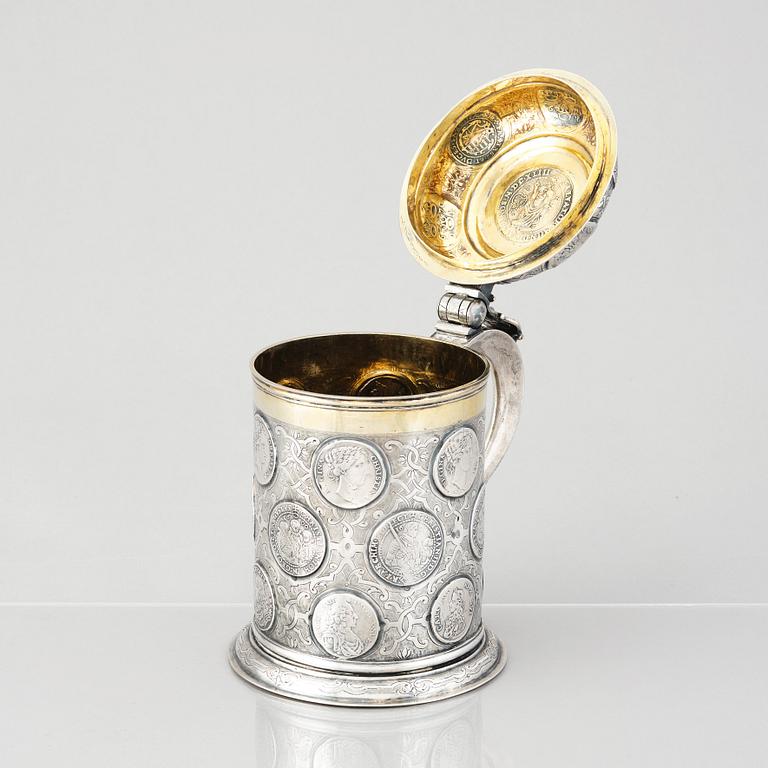 A German 18th century parcel-gilt silver coin-tankard, mark of Johann Friedrich Beyer, Schweidnitz (1736-1775).