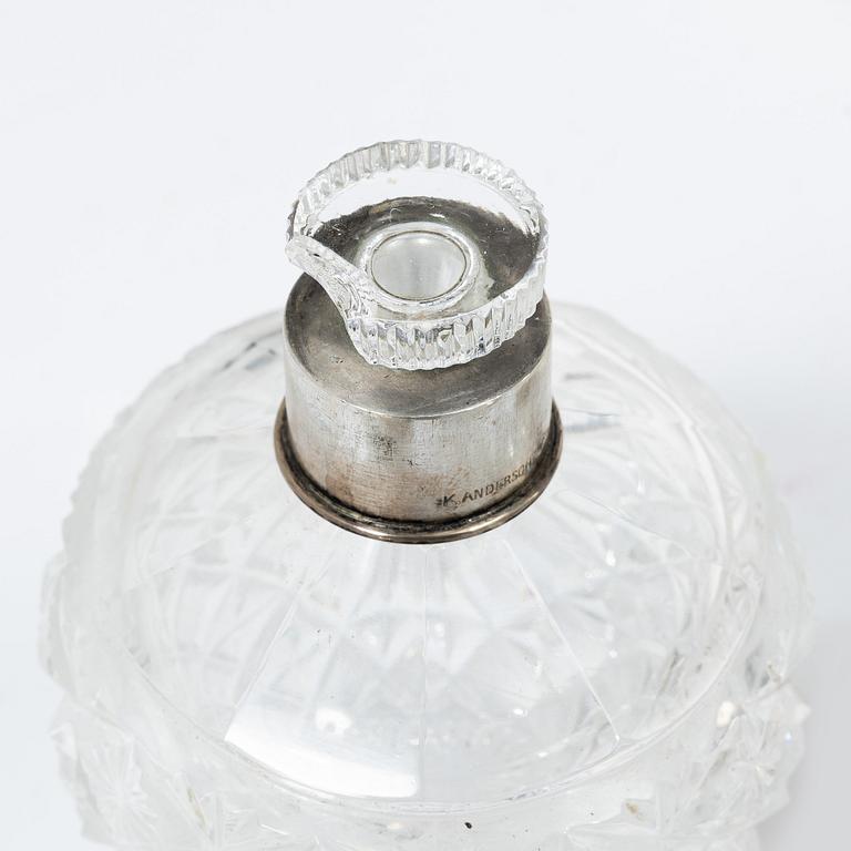 A K.Andersson silver and cut glass 'toilette set', monogrammed 'PG'. (11 pieces).