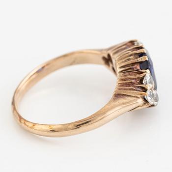 Ring, 14K gold with blue sapphire and white stones.
