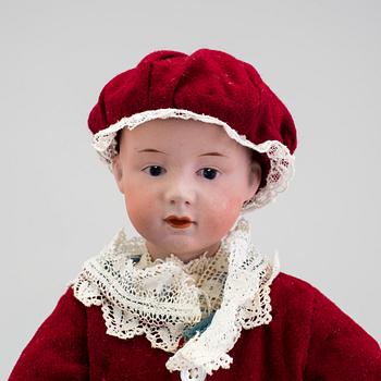 A bisque headed character boy doll, Germany, 1910s.