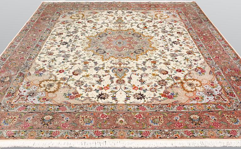 A Tabriz part silk carpet, 297 x 253 cm.