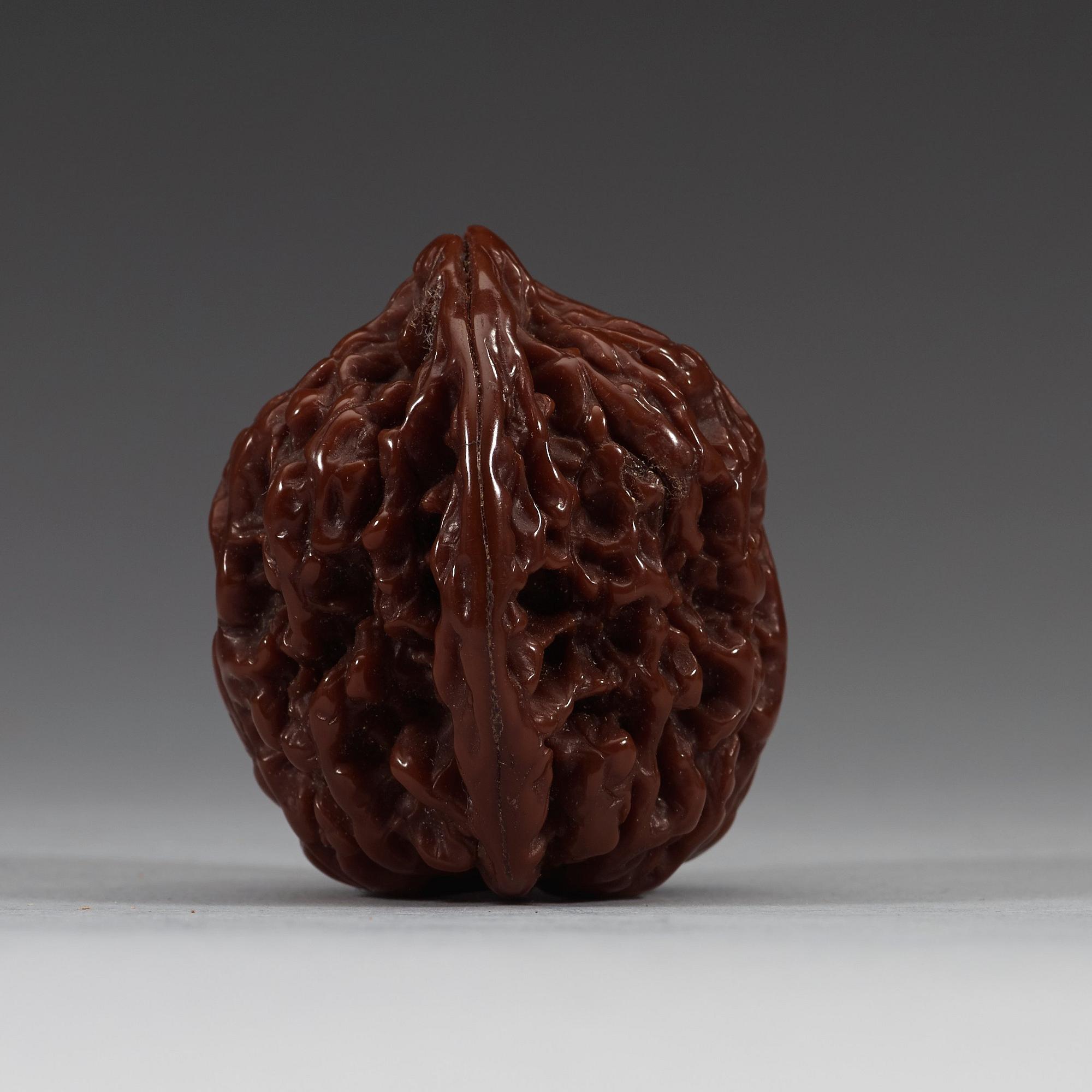 Two pairs of carved walnut hand exercisers, late Qing dynasty (1644-1912).