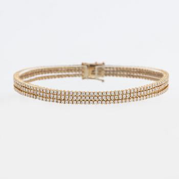 Brilliant cut diamond three strand bracelet.