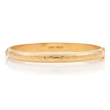 An 18K gold bangle. Ø 62 mm. Weight 12 gr.