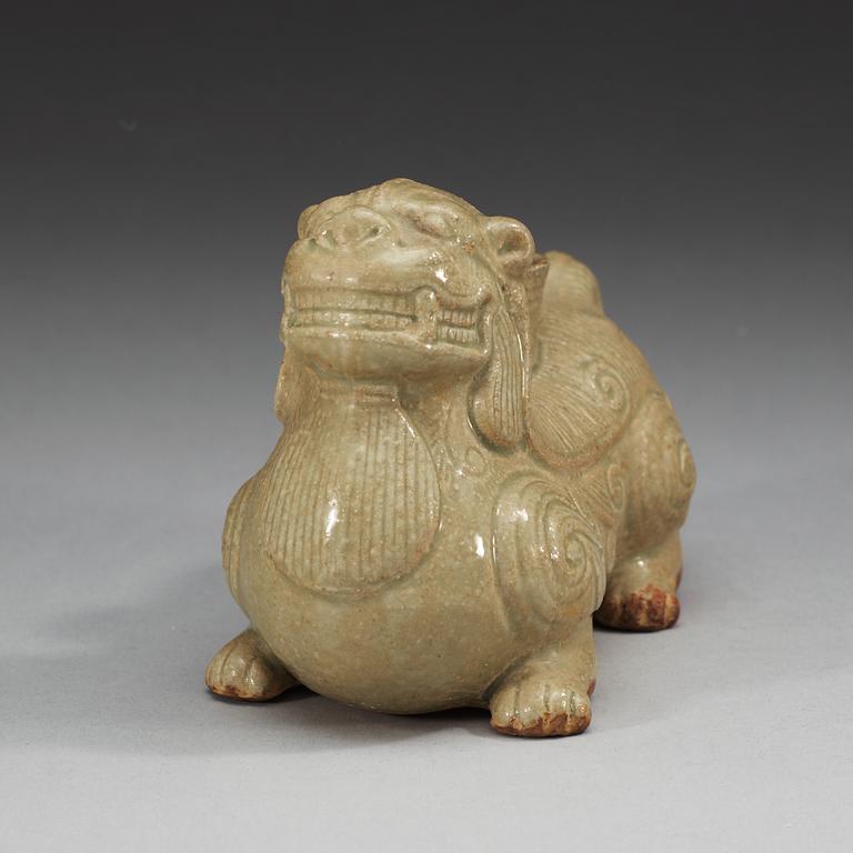 A pale celadon glazed figure of a mythological beast, Six dynasties (222-589).