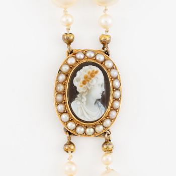 Necklace of two strands of cultured pearls, clasp 18K gold with a hardstone cameo.
