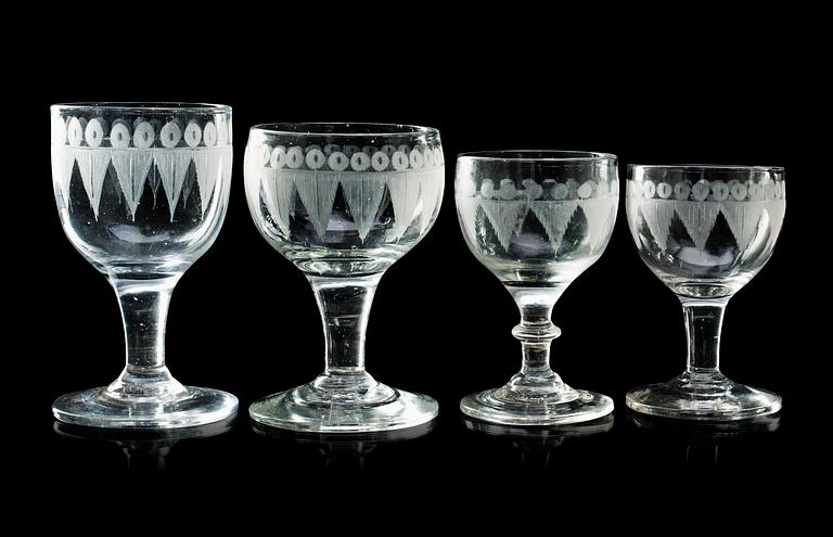 A set of 20 (9+6+4+1) engraved Swedish wine glasses, first half of 19th Century.