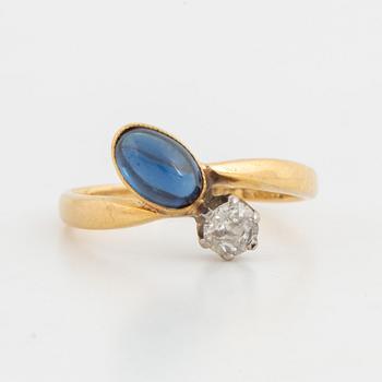 Cabochon-cut sapphire and old-cut diamond ring.