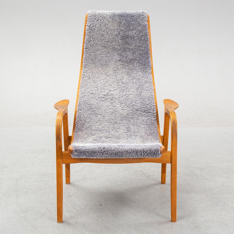 Yngve Ekström, a 'Lamino'  shearling upholstered lounge chair and foot stool from Swedese.