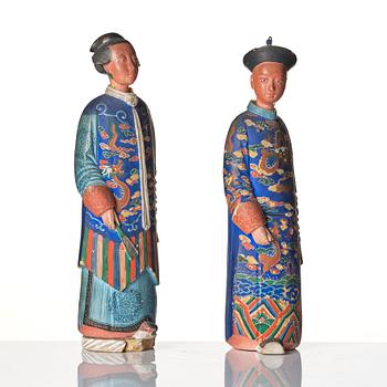 A pair of Chinese Export polychrome painted nodding head figures, Qing dynasty, early 19th Century.