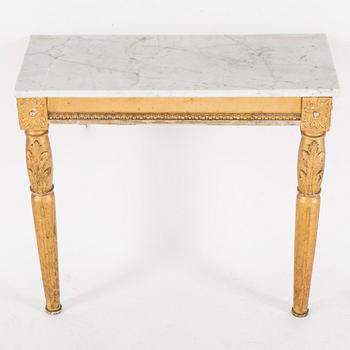 A Swedish Gustavian style mirror and console table with marble top from the first half of the 20th century.