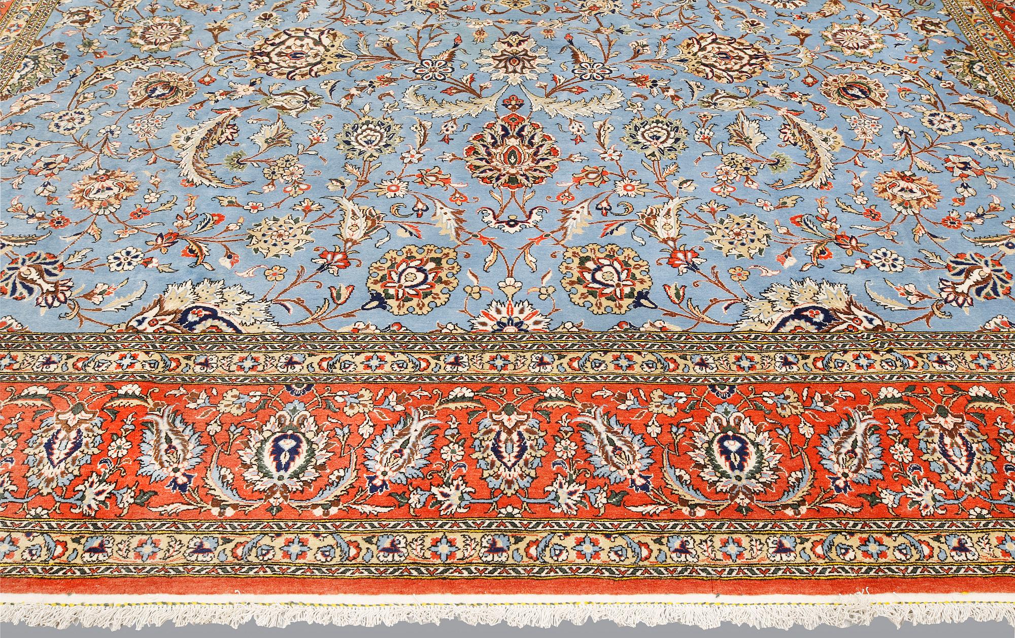 A Ghom carpet, part silk, approx. 480 x 350 cm.