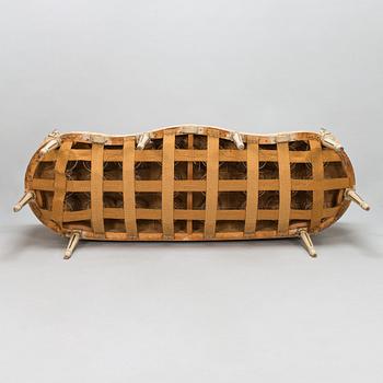 A Gustavian style sofa and table from early 20th century.