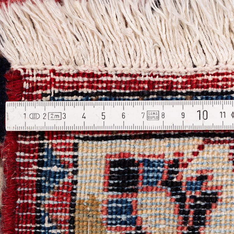A Persian carpet. ca 400 x 260 cm.
