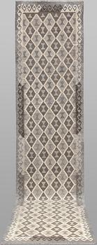 A Kilim runner carpet. 393 x 89 cm.
