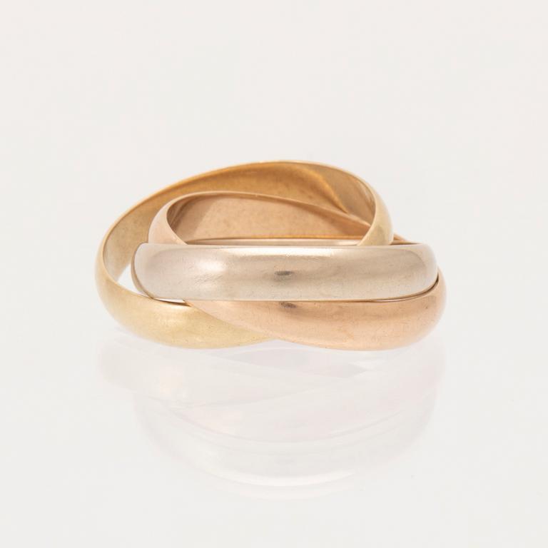 An 18K tri-coloured "Trinity" gold ring by Cartier.