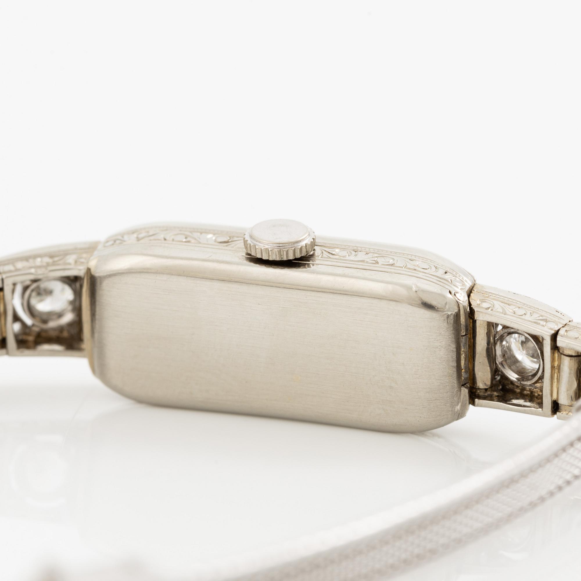 Smyckesur/Aftonklocka, boett 18K vitguld med diamanter.