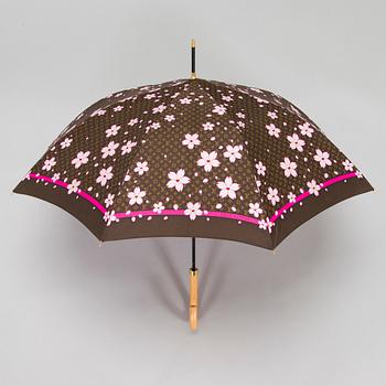 Louis Vuitton x Takashi Murakami, a 'Monogram Cherry Blossom' umbrella.