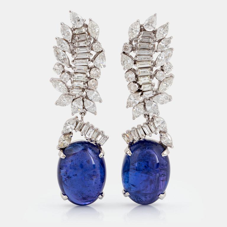 A pair of 18K gold tanzanite earings set with diamonds of various shapes.