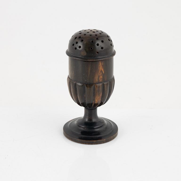 A 18th Century horn saltshaker.
